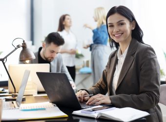 medium-shot-woman-working-laptop