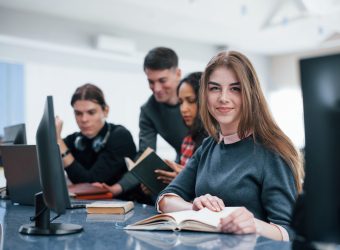 Positive mood. Group of young people in casual clothes working in the modern office.