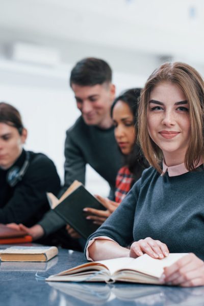 Positive mood. Group of young people in casual clothes working in the modern office.